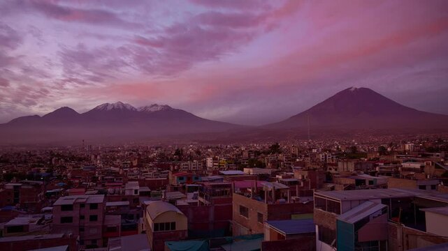 View of the Chachani and Misti volcanoes in the city of Arequipa, from sunset to nightfall.
