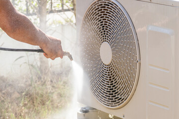air conditioning compressor outdoor unit cleaning service with water spray