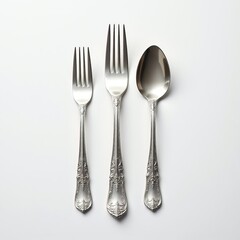 Elegant Silver Cutlery Set Including Forks and Spoon on White Background