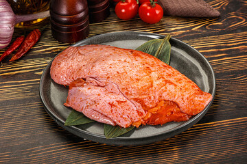 Raw marinated duck breast for cooking