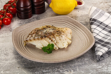 Baked cod fish fillet with spices