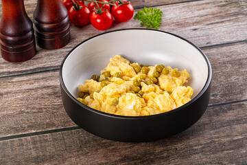 Scrambled egg omelet with green peas