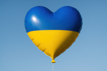 Blue and Yellow Heart Shaped Balloon Floating Against Clear Sky Symbolizing Ukrainian Flag
