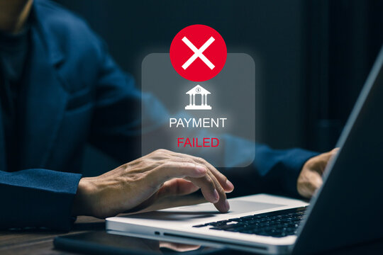 Businessman using a laptop with a digital confirmation message showing “Payment Failed,” symbolizing secure online transactions, digital banking, and financial technology.
