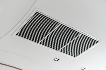 Plakat Clean modern interior showing ceiling air vent grille. hvac air conditioner ventilation duct system provides comfortable cooling for healthy indoor air quality and climate control