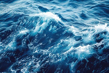 Tranquil ocean waves gently rolling over a deep blue water surface under clear skies