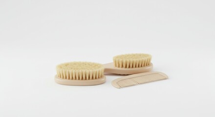 Wooden baby hairbrush and comb set on a white background