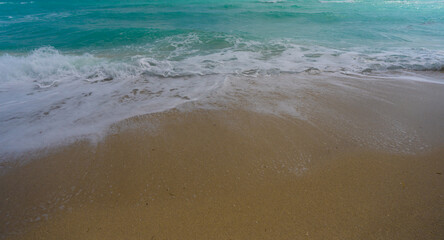 Sea beach shore. Colorful sea beach water. Warm ocean breeze. Summer sea beach. Sea background. Blue ocean. Sandy beach. Ocean waves. Summer seaside. Tropical coastline. Foamy wave splash.