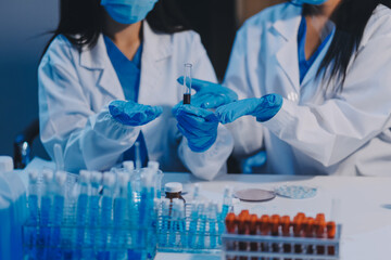 Fototapeta premium Research, experiment and medical trial being done by a scientist in a lab, science facility or hospital. One young, serious and professional researcher organizing, sorting or making a discovery