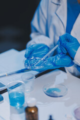Fototapeta premium Research, experiment and medical trial being done by a scientist in a lab, science facility or hospital. One young, serious and professional researcher organizing, sorting or making a discovery