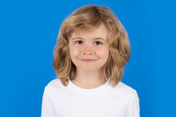 Close up portrait of cute smiling child, isolated studio background. Happy kid, happy and smiling emotions.