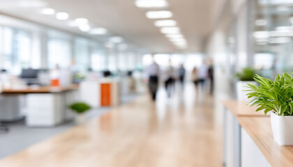Fototapeta premium Bright modern office interior with blurred people walking and green plants on desks, creating lively and fresh workspace atmosphere