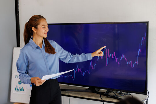 Employees, computer finance, stock market and graphs on screen for data analytics. Asian Business people, collaboration and teamwork or support, training and statistics on investment revenue
