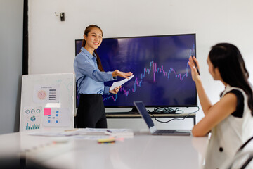 Employees, computer finance, stock market and graphs on screen for data analytics. Asian Business people, collaboration and teamwork or support, training and statistics on investment revenue