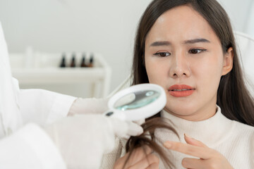 Specialist of hair recheck hair of Asian woman, damaged hair, hair loss, thinning problem, vitamin...
