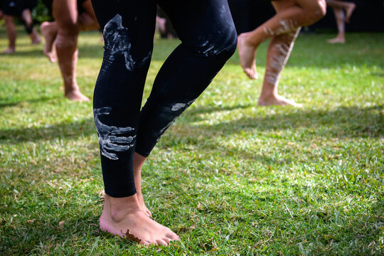 The legs of Indigenous teenagers performing an Aboriginal cultural dance - horizontal