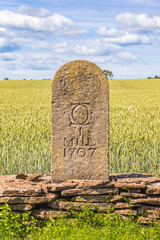 Old milestone by the roadside