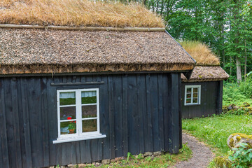 Old wooden croft with thatched roof