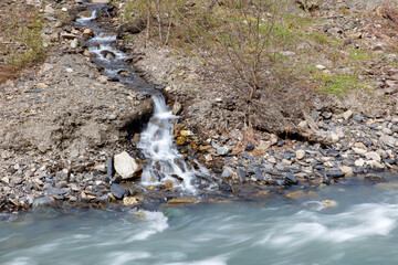 A stream of water flows through a rocky area