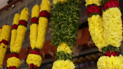 Indian flower necklace on the market. Decoration for holiday and festival