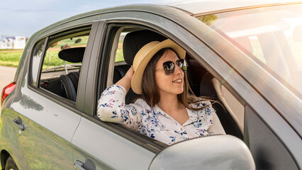 Family in car. Man woman child traveling. Summer adventure road smile.
