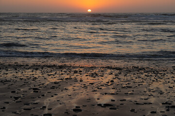 Sunset landscape in the Barriga beach in the Sudoeste Alentejano and Vicentina coast Natural Park. Vila do Bispo, Portugal.