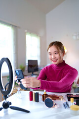 Asian Women Recording Makeup Tutorial for Her Vlog with Ring Light and Cosmetics Products Beauty and Skincare for Video Bloggers