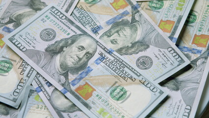 A Stack of Money consisting of U.S. Hundred Dollar Bills neatly arranged and photographed