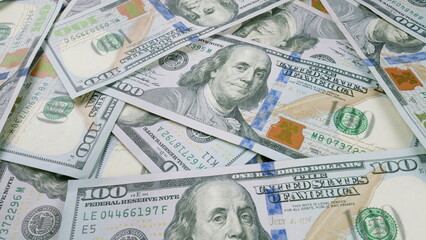 A large stack of U.S. 100 Dollar Bills showcasing abundance and vast financial assets available