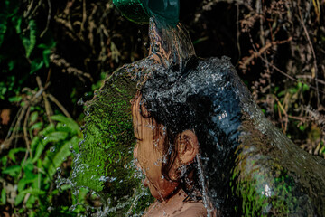 girl playing in the water in a small river