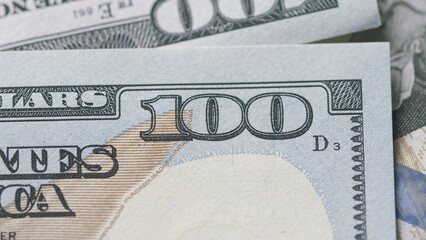 CloseUp of U.S. Hundred Dollar Bills Featuring Detailed Design and Value Indicators © beholdereye
