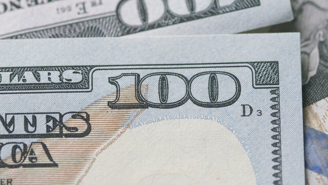 CloseUp of U.S. Hundred Dollar Bills Featuring Detailed Design and Value Indicators