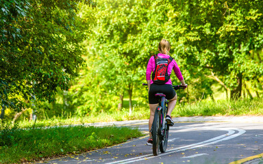 Cyclist ride on the bike path in the city Park
