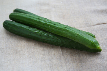 fresh summer vegetables on a linen tablecloth, cucumber