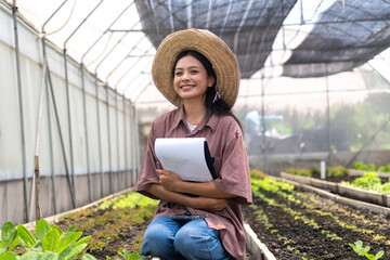 Children learn to grow vegetables and collect data from experimental vegetable plots in a temperature-controlled greenhouse.