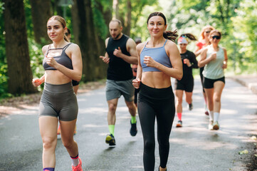 Marathon conception, front view. Group of runners are together outdoors