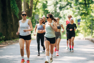 Obraz premium Marathon conception, front view. Group of runners are together outdoors