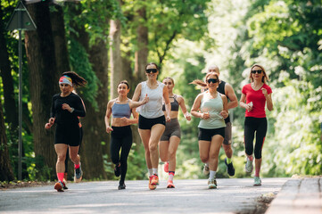 Obraz premium Training and jogging. Group of runners are together outdoors