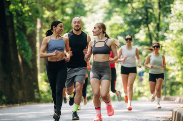 Training and jogging. Group of runners are together outdoors