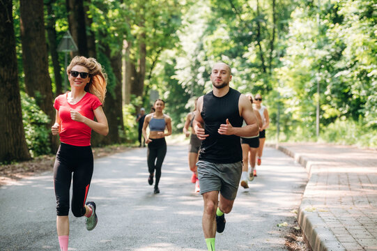 Training and jogging. Group of runners are together outdoors