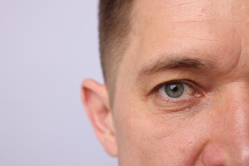 Handsome man on light background, closeup view