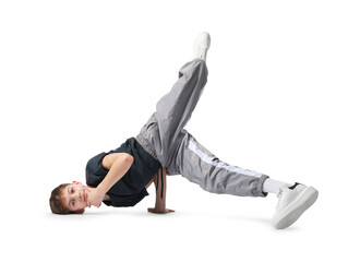 Boy in stylish clothes dancing on white background