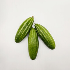 Potol or pointed gourd vegetable on isolated white background. Pointed gourds over white background. Green vegetable. High resolution image.