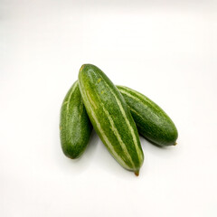 Potol or pointed gourd vegetable on isolated white background. Pointed gourds over white background. Green vegetable. High resolution image.