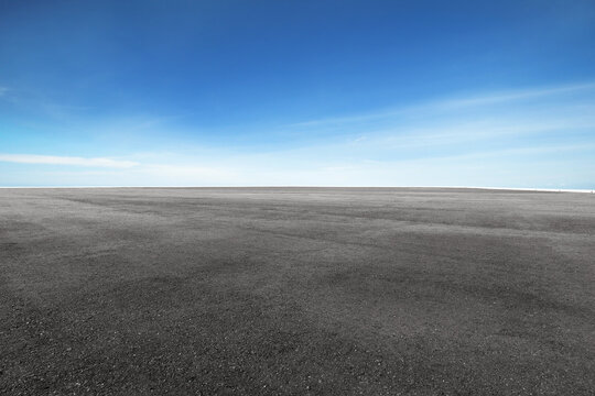Fototapeta Panoramic empty asphalt road platform under the blue sky,.