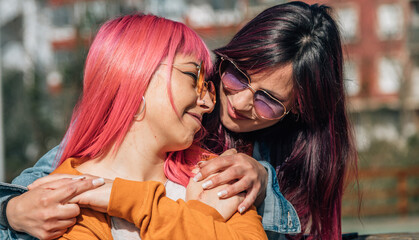 Two happy same-sex people in love on the street