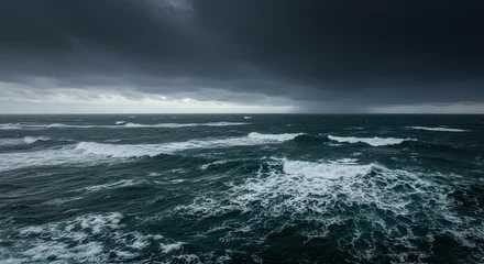 Store enrouleur Vagues de l'océan Dramatic seascape with stormy dark clouds and waves crashing on the ocean surface  © Angga Yudistira