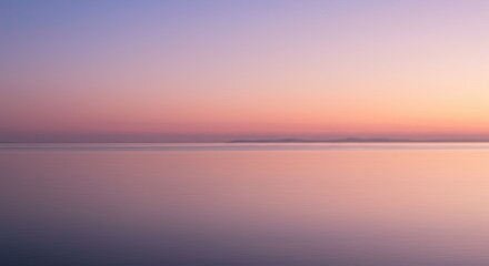 Obraz premium Serene view of a tranquil ocean at dusk with a beautiful gradient sky and horizon line