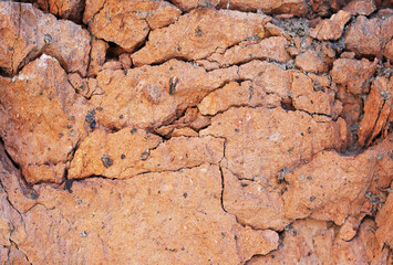 Demaged bricks and stone red orange surface grungy background