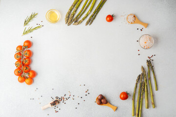 Assorted vegetables and spices composition with copy space in center on  light  background